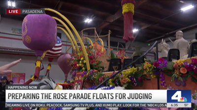 Finishing touches are made on the the Rose Parade floats