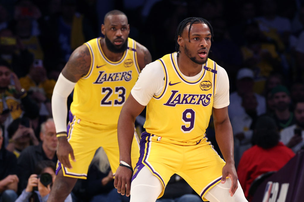 No. 4: LeBron and Bronny James make NBA History<br><br>LeBron James and his son, Bronny, made NBA history during the opening game of the Los Angeles Lakers season on October 22, 2024 against the Minnesota Timberwolves at Crypto.com arena. LeBron and Bronny James became the first father-son duo in NBA history to share the court as teammates when they entered the game together at the end of the second quarter. The Lakers went on to win the game 110-103. (Photo by Harry How/Getty Images)