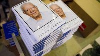 FILE – Copies of former President Jimmy Carter’s book, “A Full Life: Reflections at Ninety,” sit in stacks at the Free Library in Philadelphia, July 10, 2015.