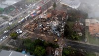 Police carry out an investigation by houses that were hit by a plane in Gramado, Rio Grande do Sul state, Brazil, Sunday, Dec. 22, 2024.