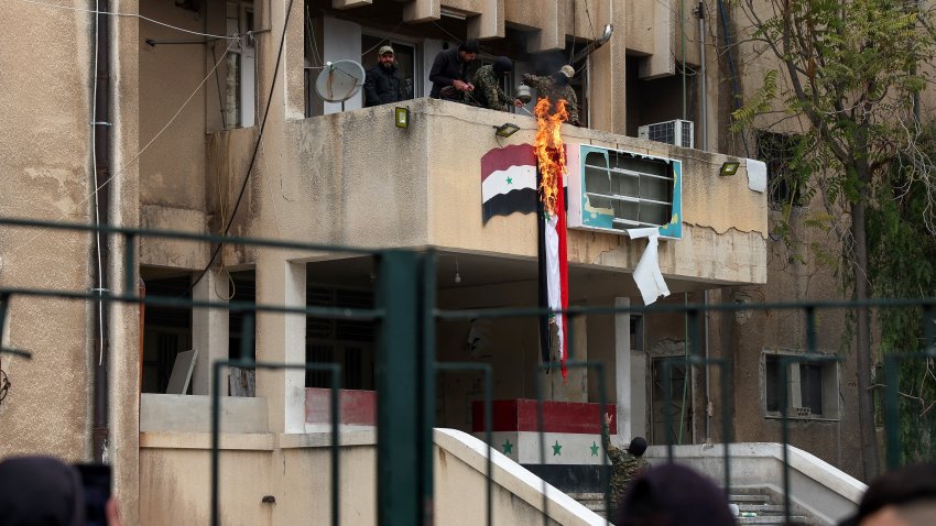 A Syrian flag on fire