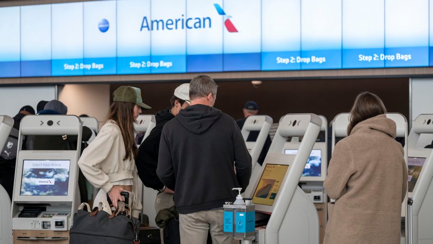 Travelers At SFO Airport Ahead Of Christmas Holiday