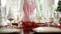 Woman Standing by Table Decorated for Christmas