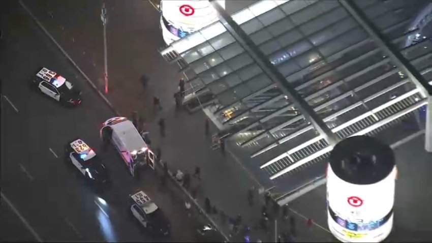 Police respond to a shooting near the Target store in downtown Los Angeles on Monday, Dec. 30, 2024.