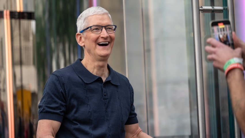 Tim Cook, chief executive officer of Apple Inc., greets customers during the first day of in-store sales of Apple’s latest products at Apple’s Fifth Avenue store in New York, US, on Friday, Sept. 20, 2024. 