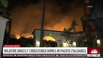 Wildfire threatens homes in Pacific Palisades