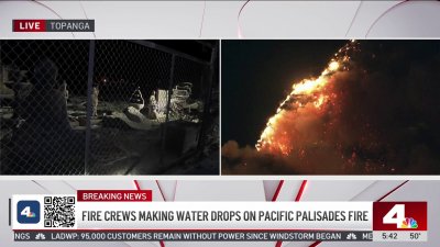 Fire crews making water drops on Pacific Palisades fire