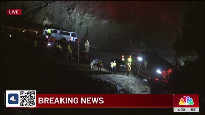 Cars trapped in muddy road in Woodland Hills