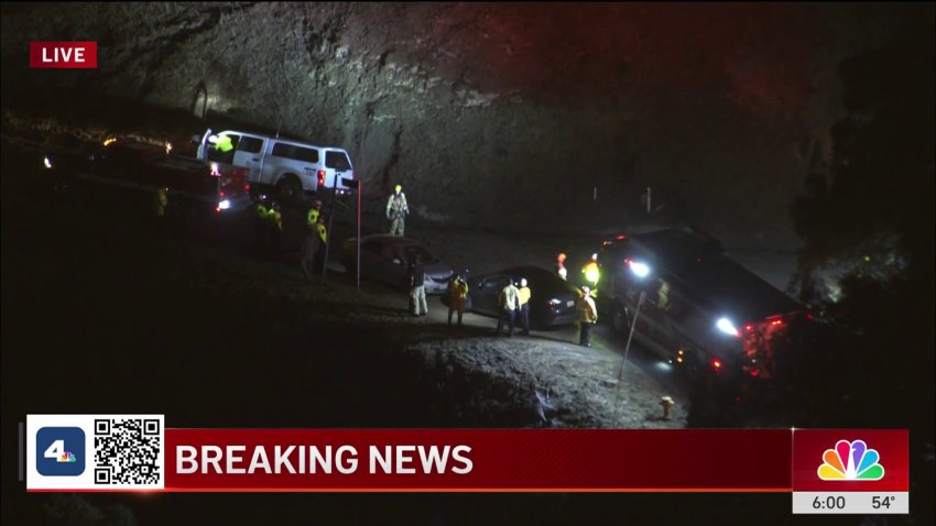 Cars trapped in muddy road in Woodland Hills