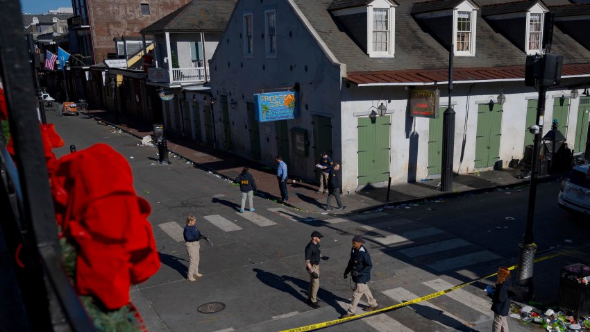 Members of the FBI walk around Bourbon Street during the investigation of a truck fatally crashing into pedestrians on Bourbon Street in the French Quarter in New Orleans, Wednesday, Jan. 1, 2025.