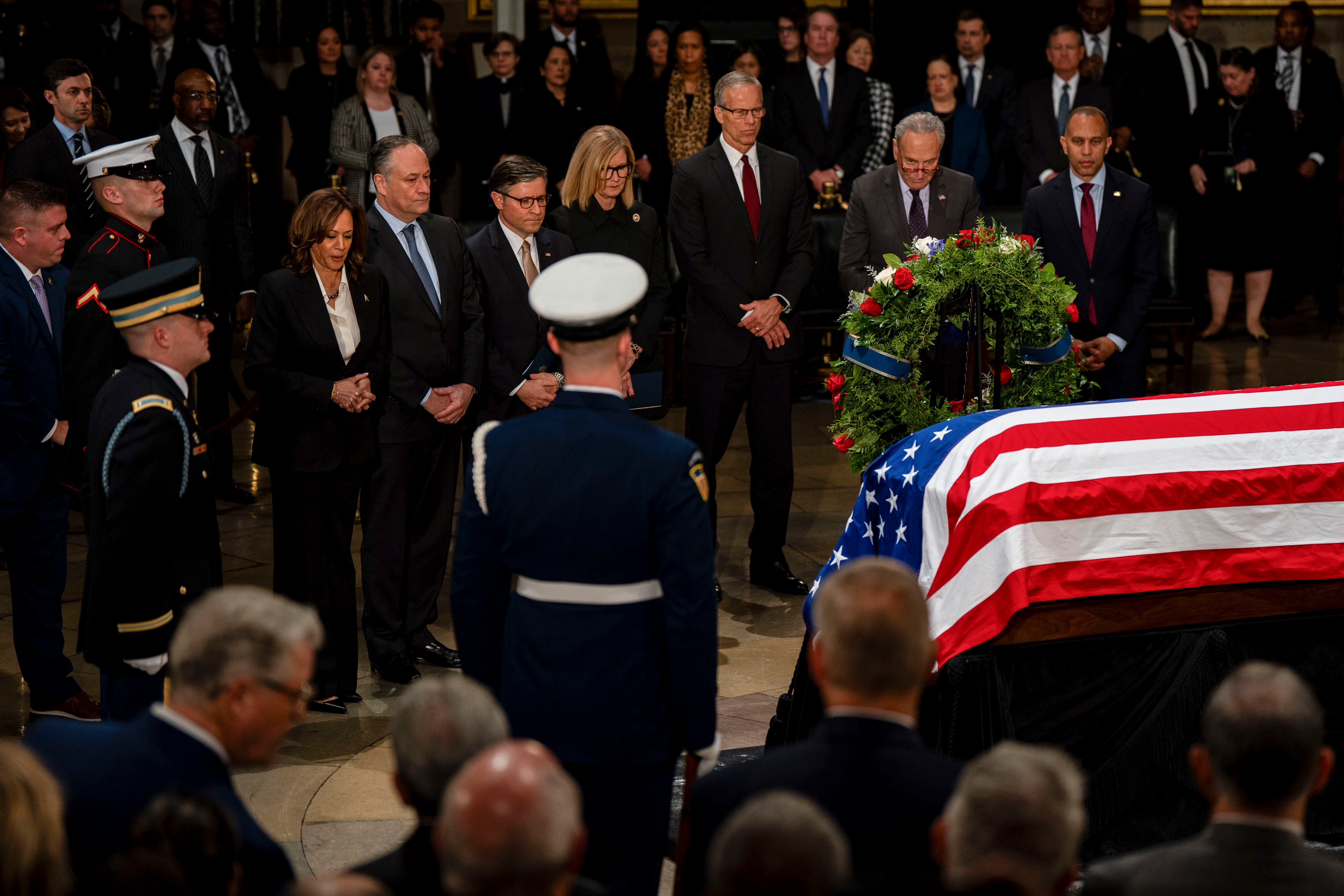 US Vice President Kamala Harris, from left, Second Gentleman Doug Emhoff, US House Speaker Mike Johnson, a Republican from Louisiana, Senate Majority Leader John Thune, a Republican from South Dakota, Senate Minority Leader Chuck Schumer, a Democrat from New York, and Representative Hakeem Jeffries, a Democrat from New York, attend a ceremony for late former US President Jimmy Carter in the Rotunda of the US Capitol in Washington, DC, US, on Tuesday, Jan. 7, 2025.