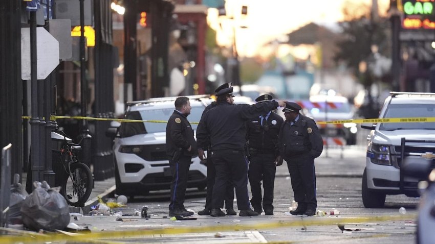 Security personnel gather at the scene on Bourbon Street after a vehicle drove into a crowd on New Orleans’ Canal and Bourbon Street, Wednesday Jan. 1, 2025. (AP Photo/Gerald Herbert)