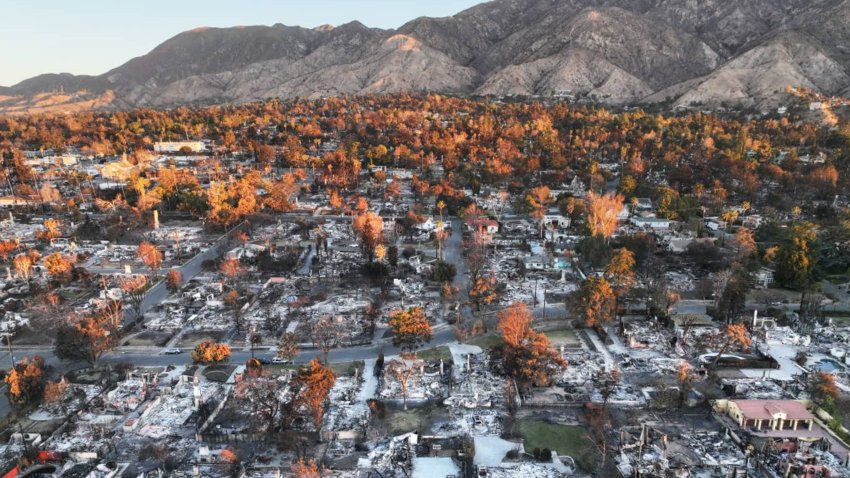 An aerial view of the sun rising above homes that burned in the Eaton Fire on January 21, 2025 in Altadena, California. 