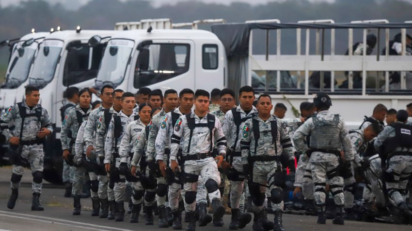 Mexican National Guards prepare to board an aircraft at the International Airport in Merida, Mexico, Tuesday, Feb. 4, 2025, to travel north to reinforce the country’s border with the United States.