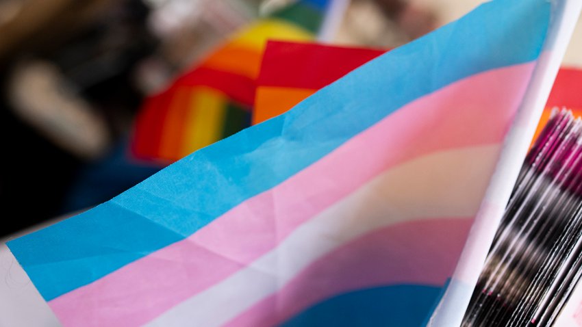 FILE - A transgender pride flag is displayed at a booth during Portland Pride on July 21, 2024, in Portland, Ore.