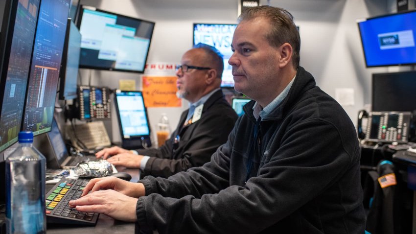 Traders work on the floor of the New York Stock Exchange on Feb. 13, 2025