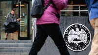 People walk past the headquarters of the U.S. Small Business Administration in the Southwest Federal Center area on March 24, 2025 in Washington, DC. 