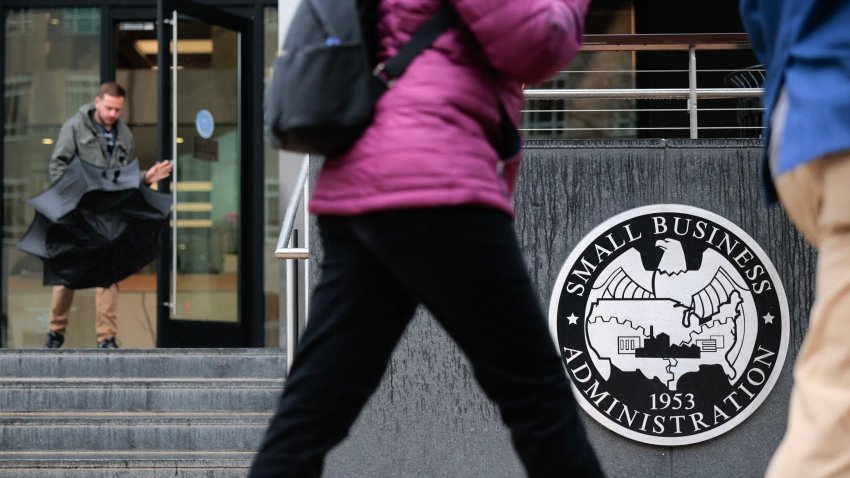 People walk past the headquarters of the U.S. Small Business Administration in the Southwest Federal Center area on March 24, 2025 in Washington, DC. 