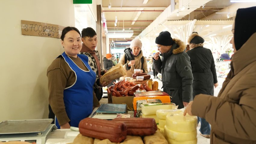 ASTANA, KAZAKHSTAN – JANUARY 26: People purchase sausages and cheese at the agricultural trade market on January 26, 2025 in Astana, Kazakhstan.  