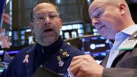 Traders work on the floor at the New York Stock Exchange in New York City, U.S., March 27, 2025.