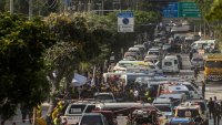Thai rescue workers arrive on scene at a construction building collapse in the Chatuchak area following an earthquake on March 28, 2025 in Bangkok, Thailand. 