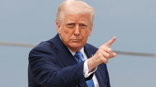 U.S. President Donald Trump gestures, before boarding Air Force One as he departs for Florida, at Joint Base Andrews, Maryland, U.S., March 28, 2025. 