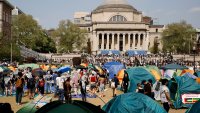 FILE – Student protesters gather inside their encampment on the Columbia University campus, April 29, 2024, in New York.