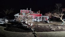 In this photo provided by Missouri State Highway Patrol, a home is damaged after a severe storm passed the area  near Ozark County, Mo., late Friday, March 14, 2025.  (Missouri State Highway Patrol via AP)
