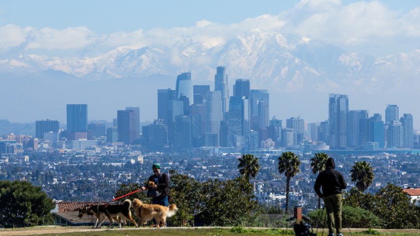 The recent rainstorms brought more snow to the local mountains as seen from Kenneth Hahn State Recreation Area in Los Angeles.