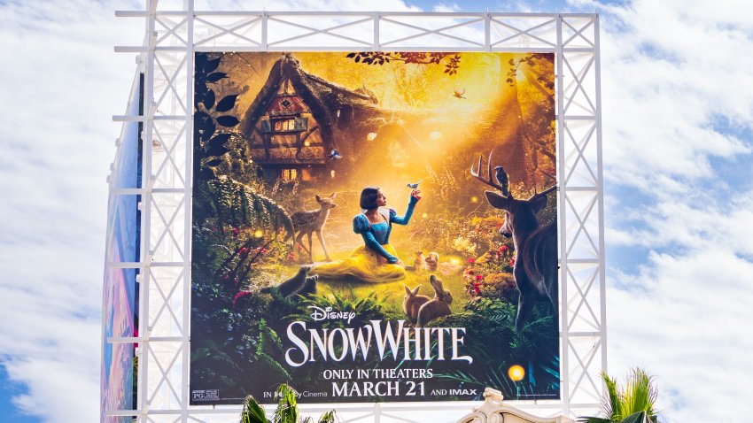 a billboard promoting the new Disney film "Snow White"