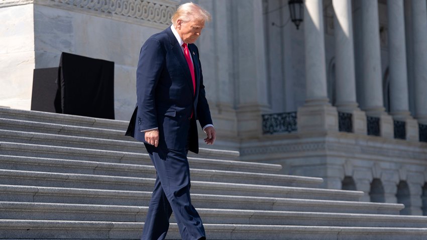 President Donald Trump walks down the stairs at the U.S. Capitol on Wednesday, March 12, 2025, in Washington.