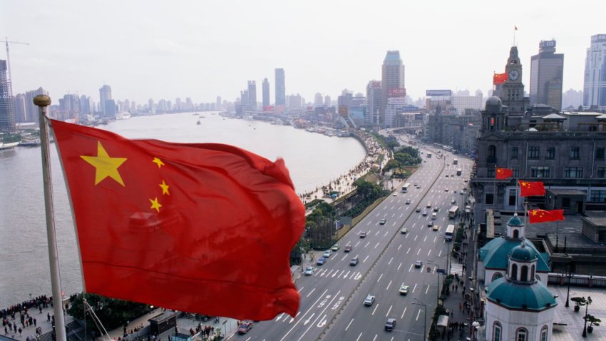 A Chinese flag flies high over The Bund.
