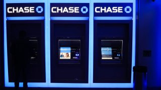 A person uses an ATM at a Chase bank in New York City on November 19, 2024. 