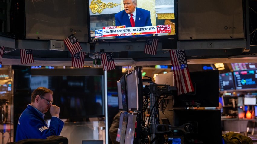 U.S. President Donald Trump is displayed on a television screen as traders work on the floor of the New York Stock Exchange (NYSE) on April 7, 2025 in New York City. 