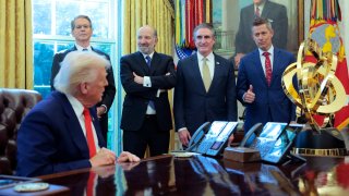 (L-R) U.S. Treasury Secretary Scott Bessent, Secretary of Commerce Howard Lutnick, Interior Secretary Doug Bergum and Transportation Secretary Sean Duffy look on as U.S. President Donald Trump prepares to sign executive orders in the Oval Office of the White House on April 09, 2025 in Washington, DC.