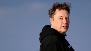 Tesla CEO Elon Musk walks to board Air Force One with U.S. President Donald Trump (not pictured) as they depart for Philadelphia, Pennsylvania, from Morristown Municipal Airport in Morristown, New Jersey, U.S., March 22, 2025.