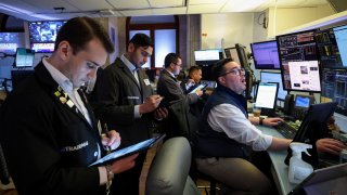 Traders work on the floor at the New York Stock Exchange in New York City, U.S., April 30, 2025.