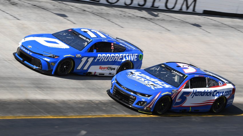Kyle Larson (5) and Denny Hamlin (11) race at Bristol