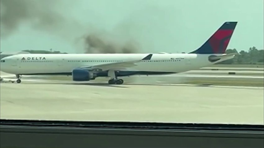 RAW: Delta plane in Orlando catches on fire