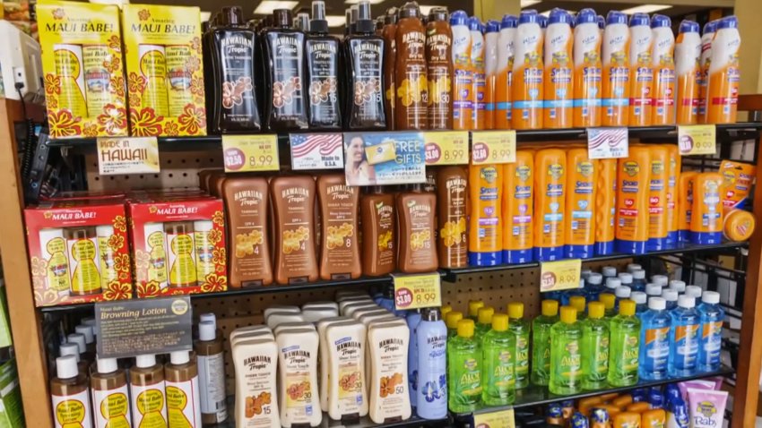 A row of sunscreens on a store shelf.