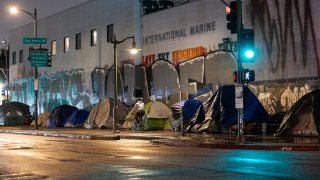 LOS ANGELES, CA – JANUARY 20: Tents that shelter homeless people line the sidewalk on January 20, 2024 in Los Angeles, California. (Photo by Qian Weizhong/VCG via Getty Images)