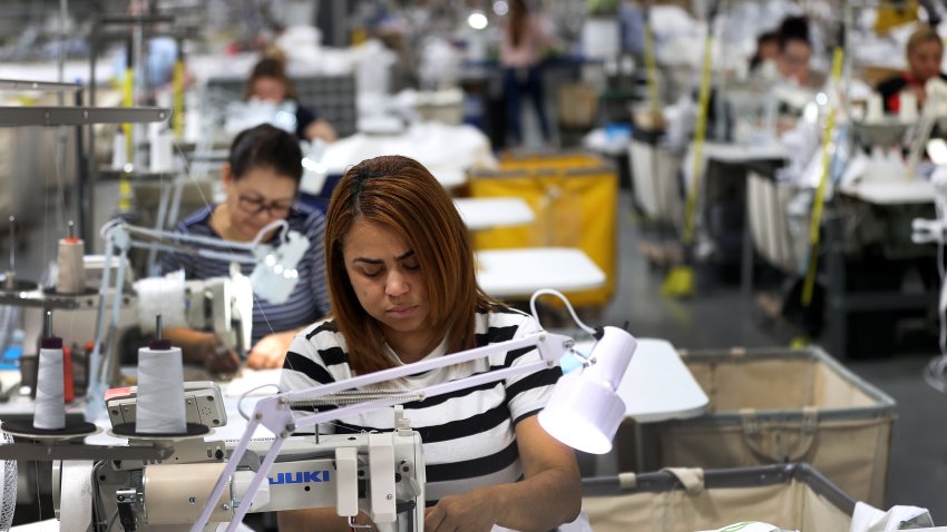 Fall River, MA – April 9: A worker on a sewing machine at the Matouk factory. (Photo by David L. Ryan/The Boston Globe via Getty Images)