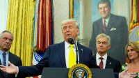 President Donald Trump speaks as Health and Human Services Secretary Robert F. Kennedy Jr., from left, Dr. Mehmet Oz and Oz's wife Lisa Oz listen during a swearing in ceremony for Mehmet Oz to be Administrator of the Centers for Medicare and Medicaid Services, in the Oval Office of the White House, Friday, April 18, 2025, in Washington.