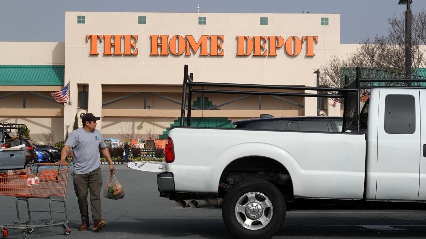A customer pushes a shopping cart in front of a Home Depot store on Feb. 25, 2025 in San Rafael, California.