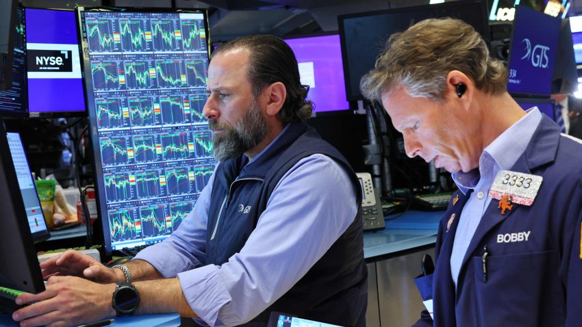 Traders work on the floor of the New York Stock Exchange during morning trading on May 07, 2025 in New York City.