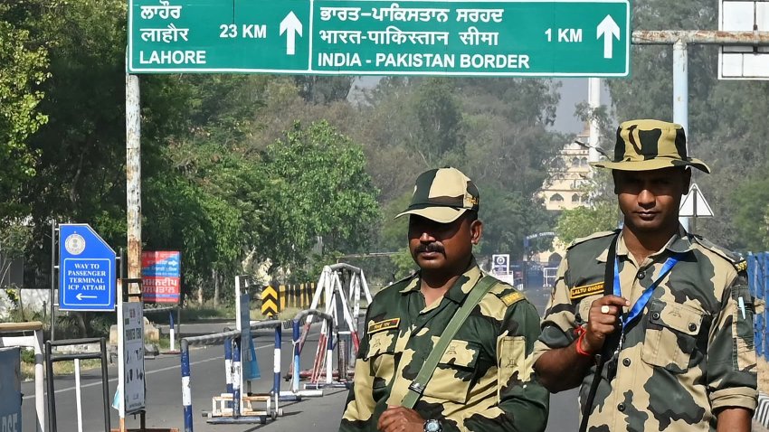 Indian Border Security Force (BSF) soldiers stand guard at the entrance of the India-Pakistan Wagah border post, about 35kms from Amritsar on April 24, 2025. India took a raft of punitive diplomatic measures against Pakistan on April 23, accusing Islamabad of supporting “cross-border terrorism” after a deadly attack on civilians in Kashmir. (Photo by Narinder NANU / AFP) (Photo by NARINDER NANU/AFP via Getty Images)