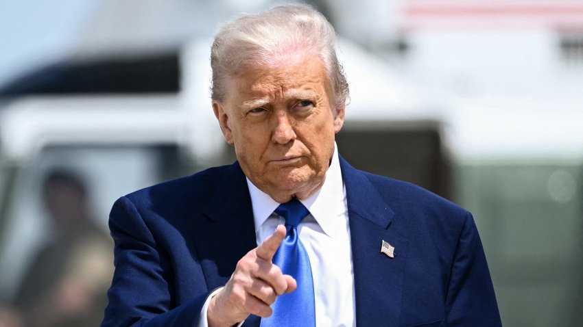 US President Donald Trump gestures as he walks to board Air Force One at Joint Base Andrews in Maryland on May 12, 2025.