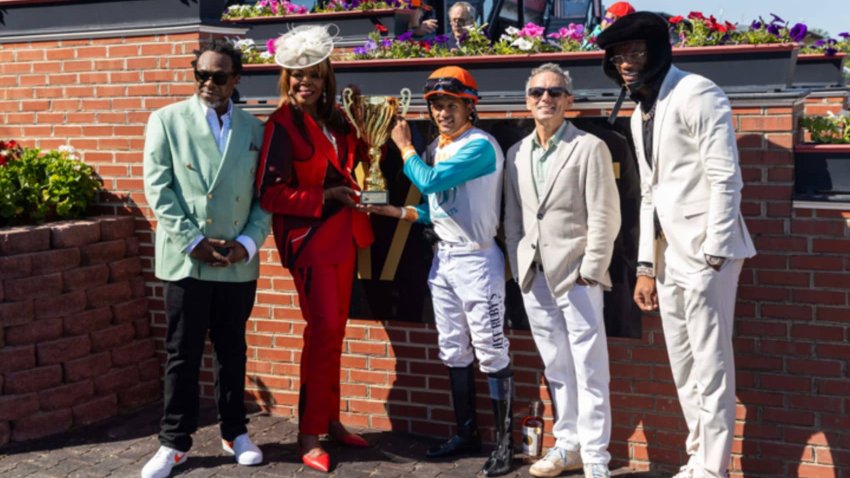 Lamar Jackson with the winners of the 2025 NTL Kickoff Race.