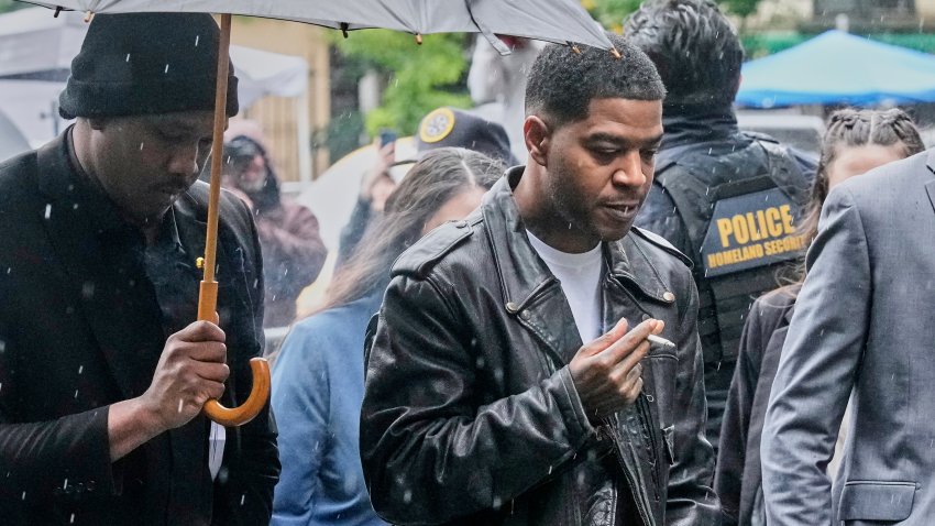 Rapper Kid Cudi, right, arrives at Federal Court for the trial of Sean “Diddy” Combs, in New York, Thursday, May 22, 2025.