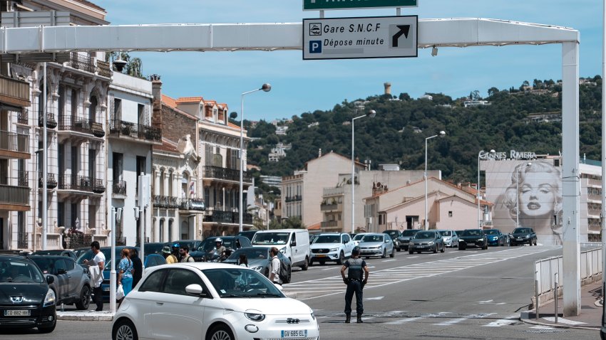 Police direct traffic during an electricity outage in Cannes, southern France, Saturday, May 24, 2025.